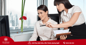 Two women in an office setting.